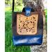 Hand Carved & finished outside pocket hand sewn onto the front of the bag.